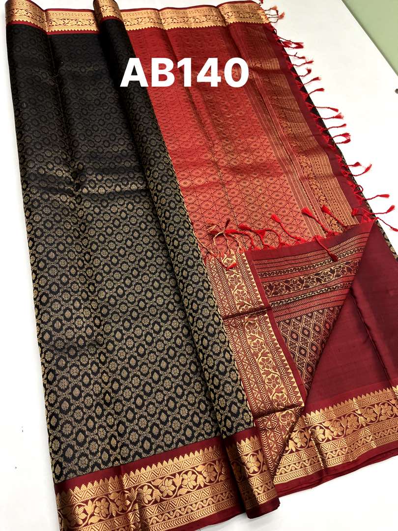 Beautifull Handloom Soft Silk Empose Design saree in Black with Marroon