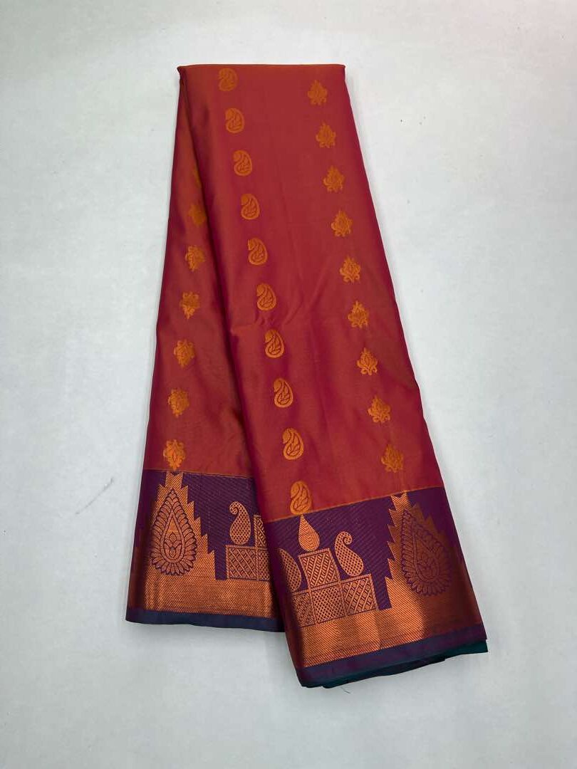 Semi  silk  Bhutta saree in Orangish pink with Yellow cross Blue